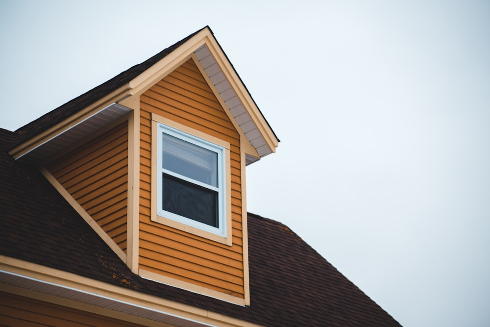 brown wooden house under white sky during daytime