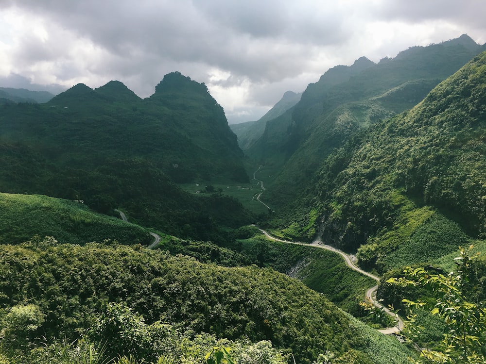 green mountains under white clouds during daytime