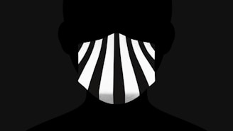 The Sonique Brothers in silhouette, their iconic masks creating a mysterious and exclusive aura against a minimalist black background.