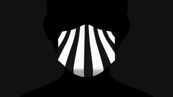 The Sonique Brothers in silhouette, their iconic masks creating a mysterious and exclusive aura against a minimalist black background.