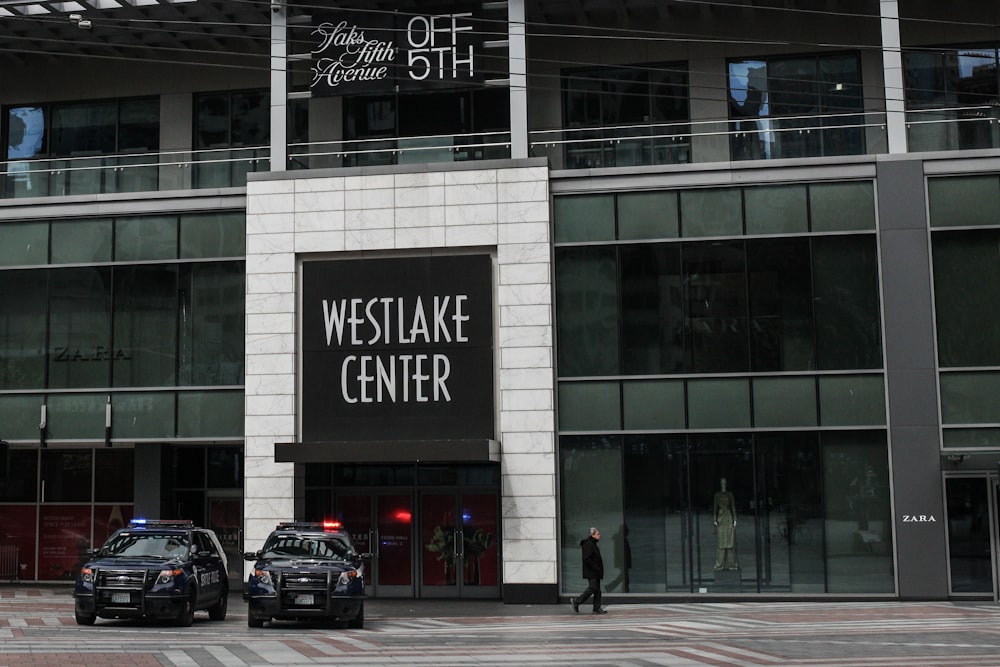 cars parked in front of building during daytime