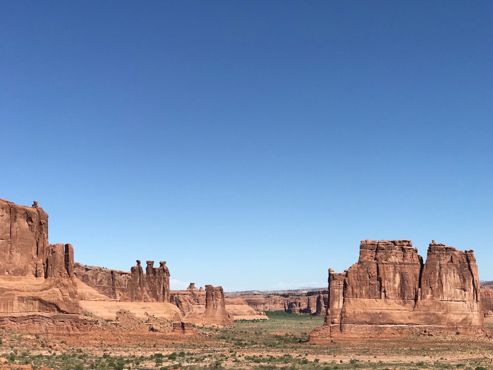 brown rock formation under blue sky during daytime