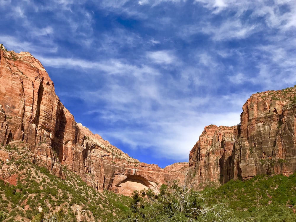 brown rocky mountain under blue sky during daytime