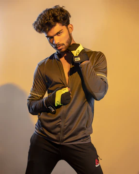 A focused male student-athlete speaking confidently during a brand campaign shoot.