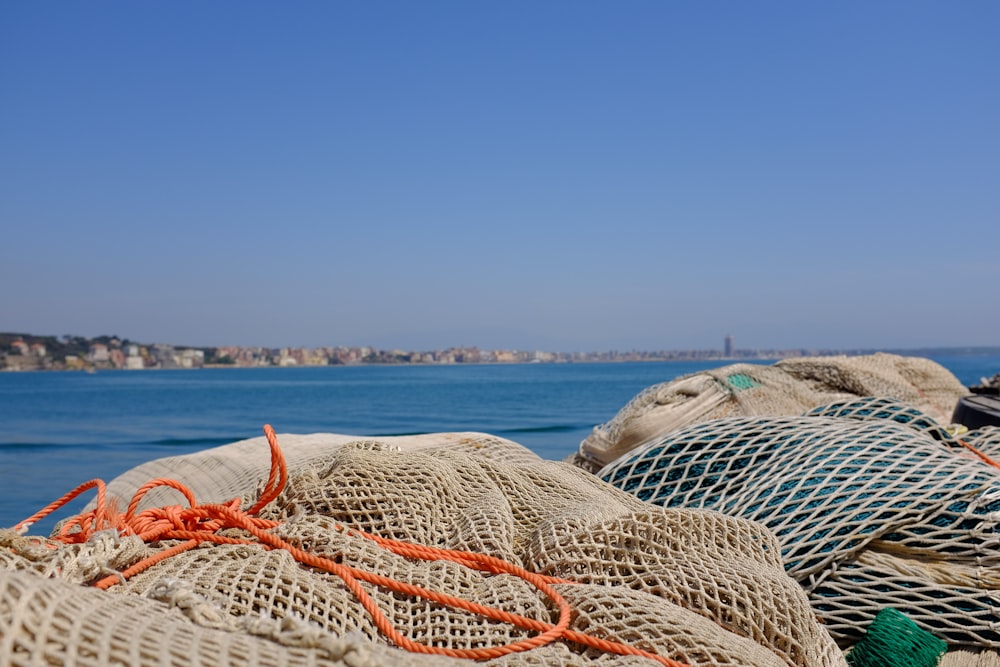 white and blue textile on beach during daytime