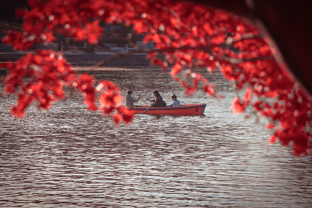 person riding on boat on body of water during daytime