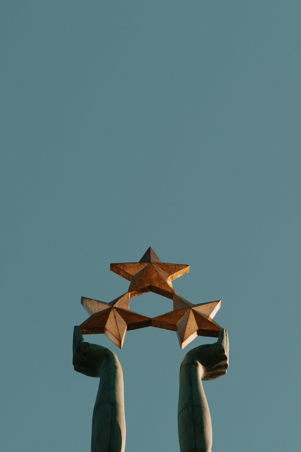 brown and black concrete building under blue sky during daytime