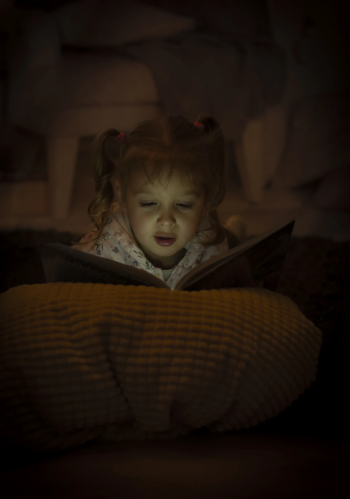 Parent reading simple bedtime stories for preschool kids