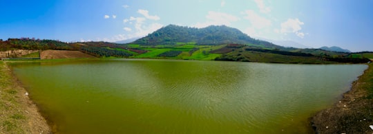 green mountain beside body of water during daytime in Gorgan Iran