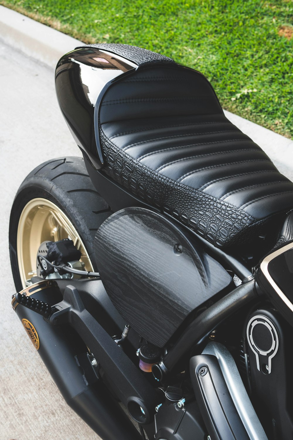 black and yellow motorcycle on gray concrete floor