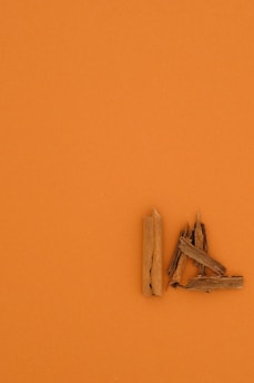 brown wooden clothes pin on orange surface
