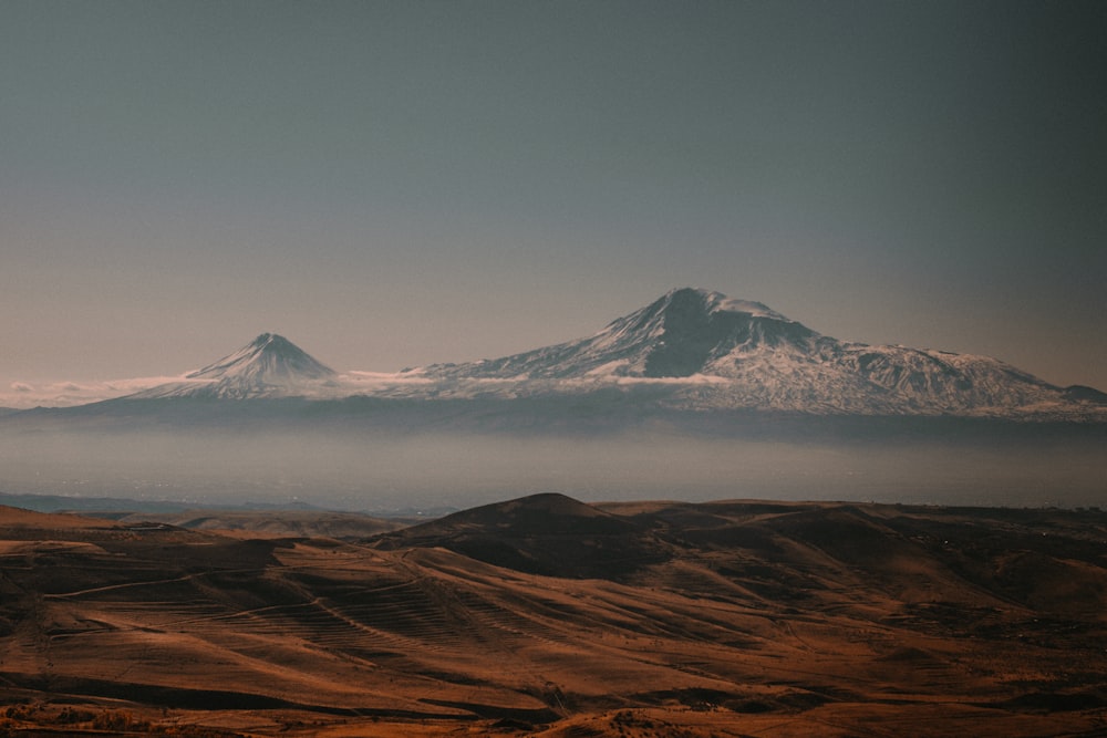 brown and white mountain under blue sky during daytime