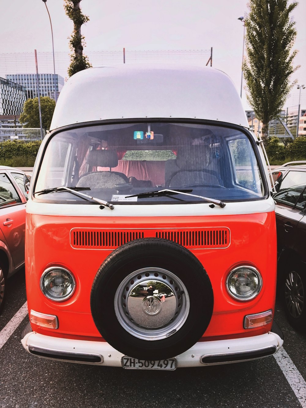 red and white volkswagen t-2