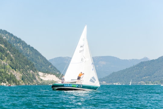white sail boat on sea during daytime in Pertisau Austria