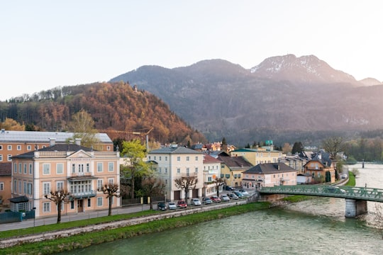 white and brown concrete building near body of water during daytime in Bad Ischl Austria