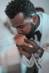 man in white dress shirt wearing silver ring