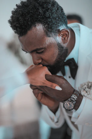 man in white dress shirt wearing silver ring
