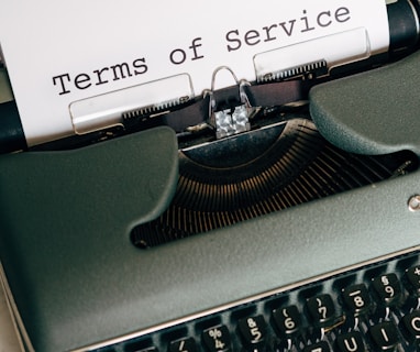 green and white typewriter with white paper