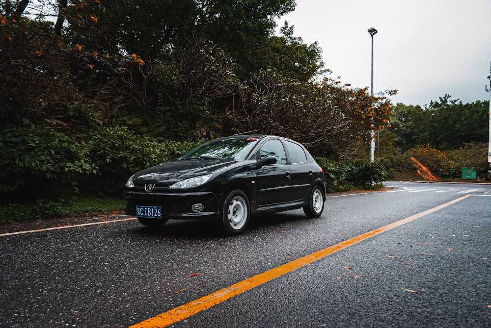 black mercedes benz coupe on road during daytime