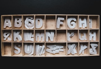 brown wooden blocks on black textile