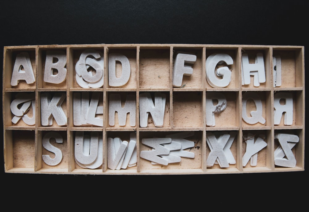 brown wooden blocks on black textile