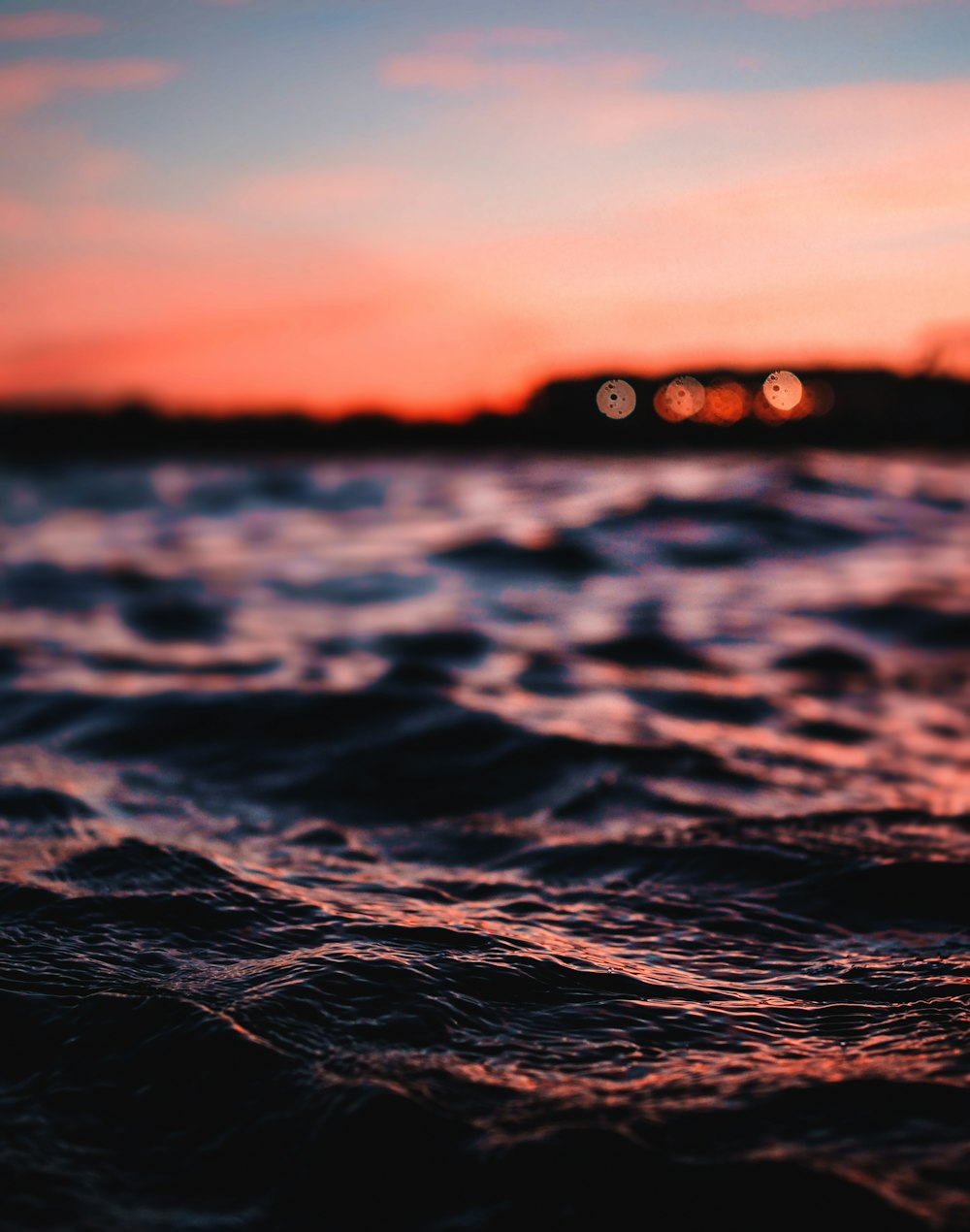 body of water during sunset