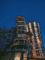 Evening shot of a commercial building showcasing innovative facade design.