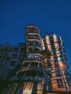 Evening shot of a commercial building showcasing innovative facade design.
