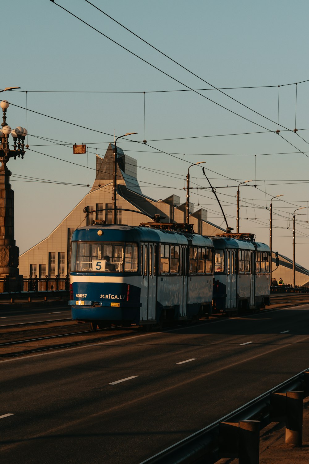 yellow and blue train on rail road during daytime