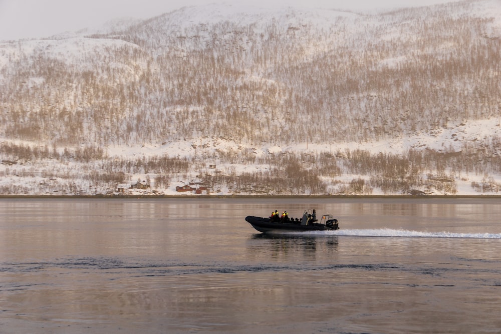 people riding on boat on water during daytime