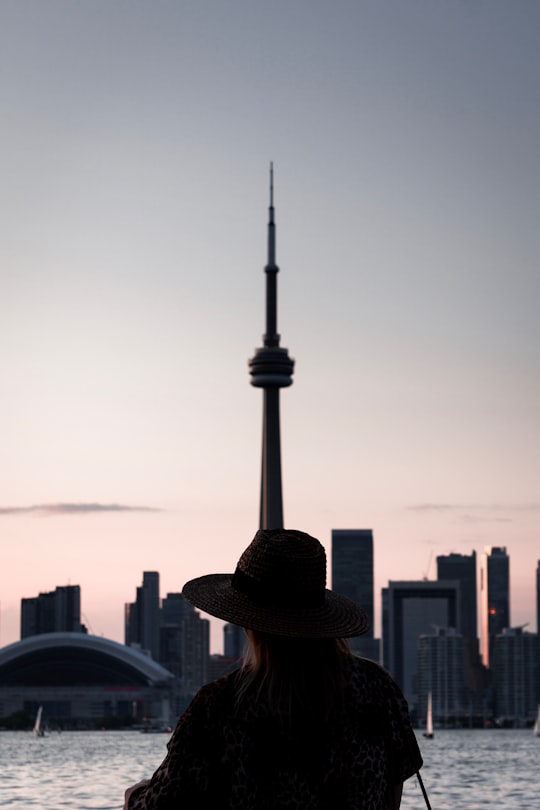 brown and black fedora hat in CN Tower Canada
