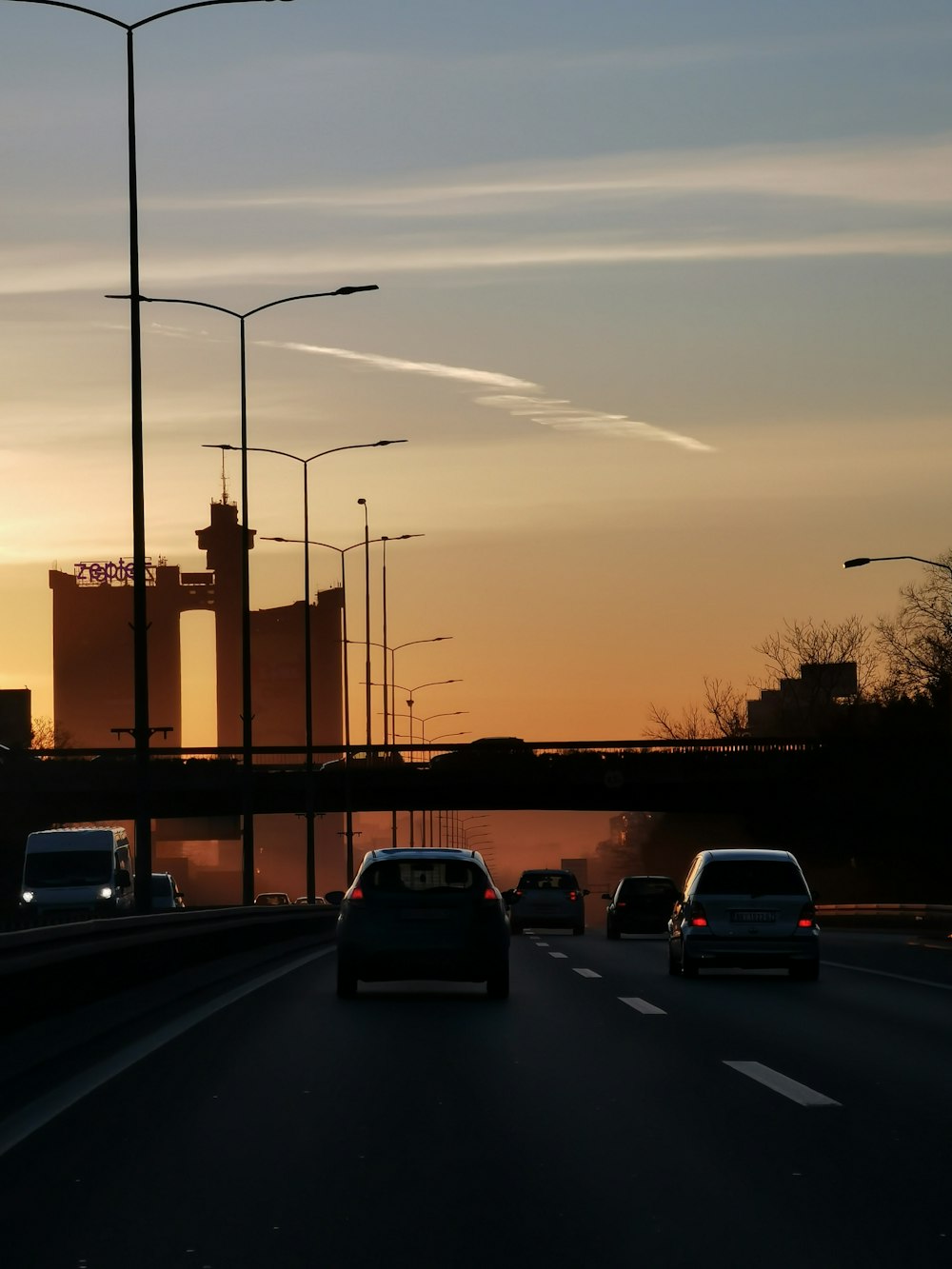 cars on road during sunset