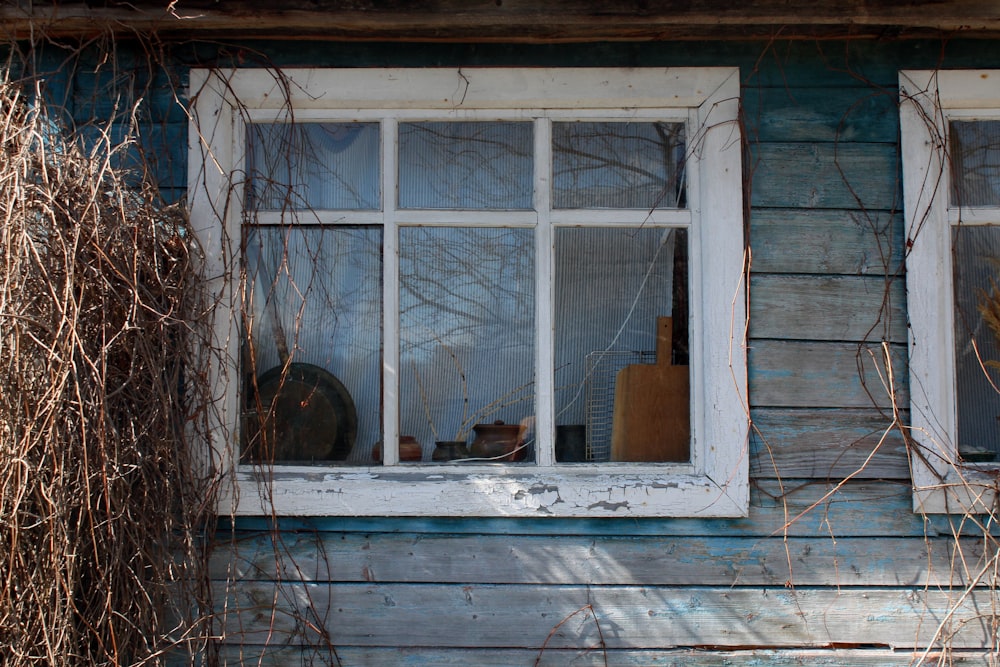 white wooden framed glass window