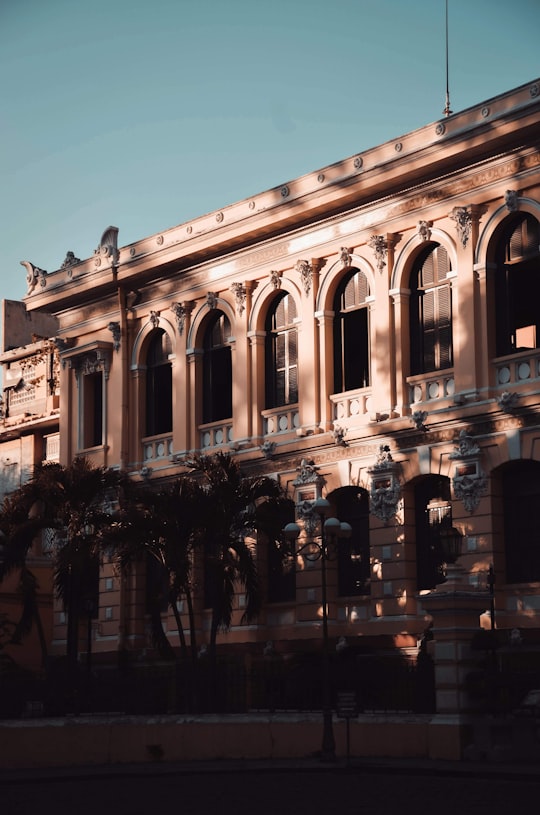 people walking on street near building during daytime in Saigon Post Office Vietnam