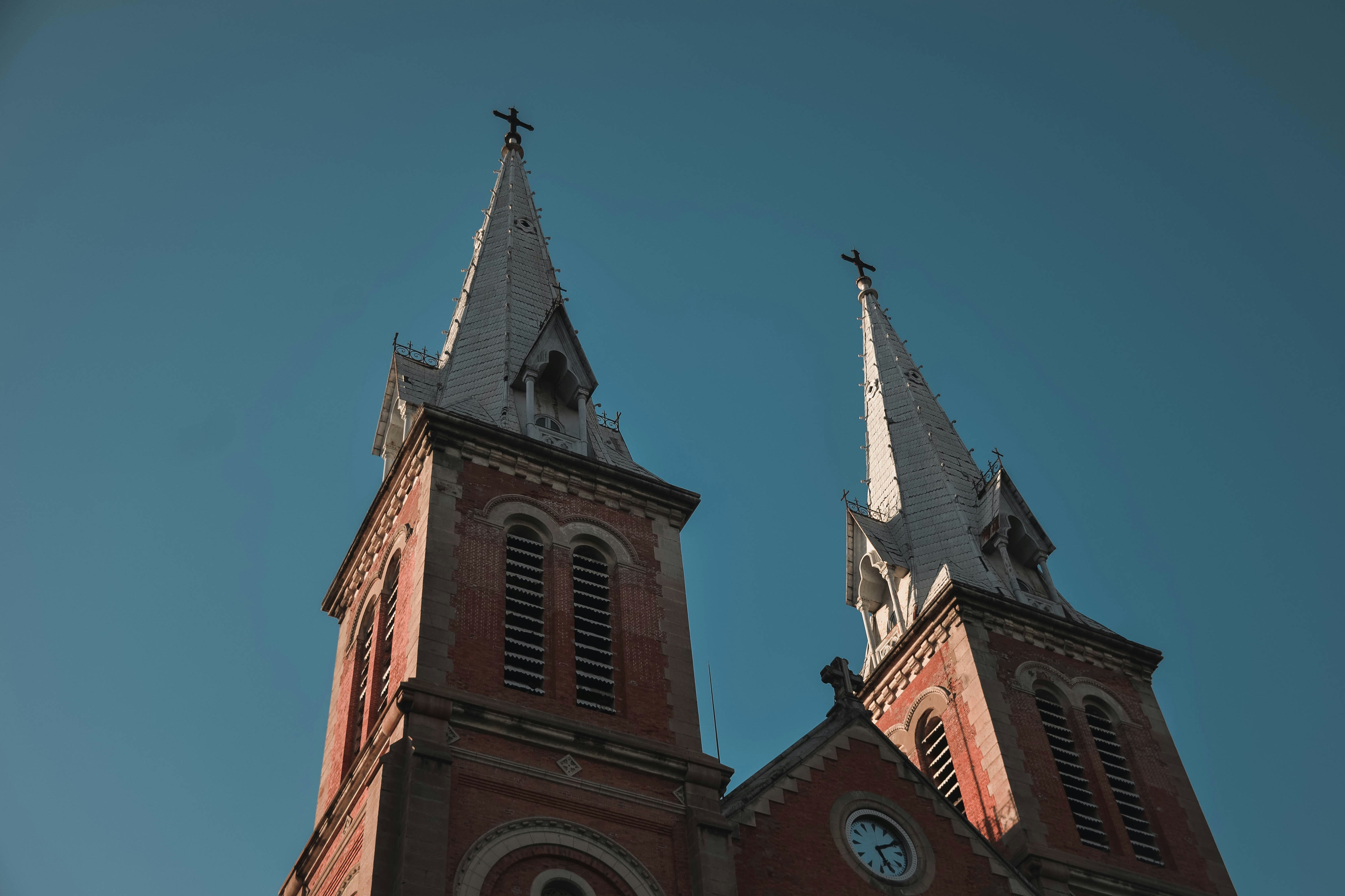 brown concrete church under blue sky during daytime