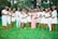 A group of diverse women smiling and celebrating their weight loss achievements together outdoors.
