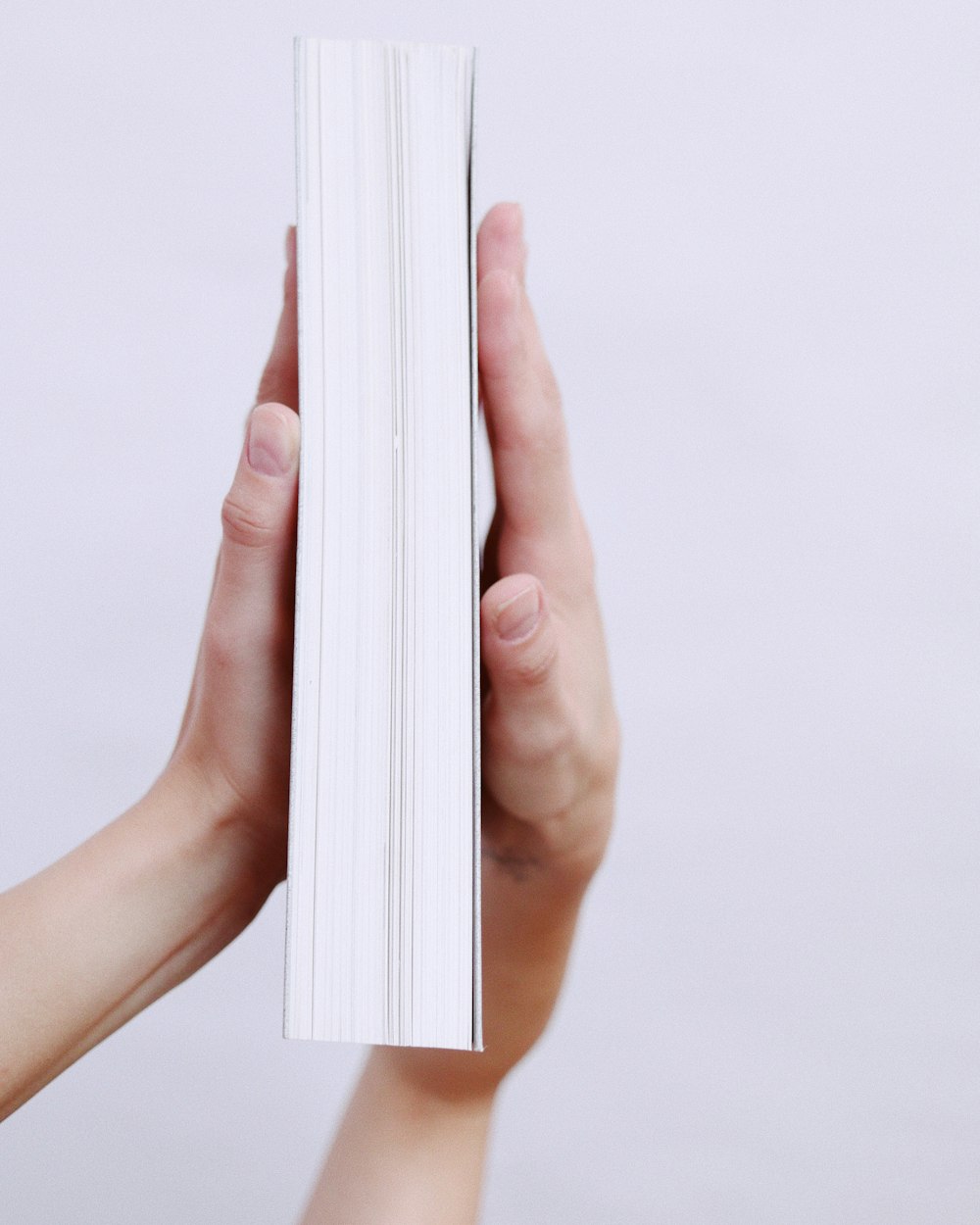 person holding white printer paper