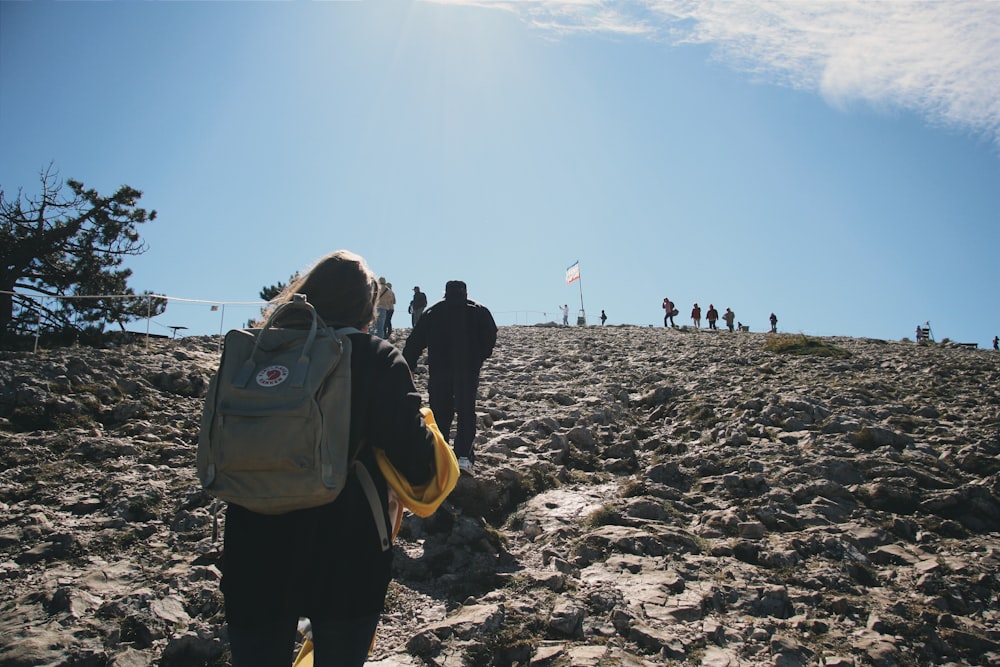 people walking on gray sand during daytime