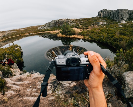 person holding black and gray dslr camera in Serra da Estrela Portugal