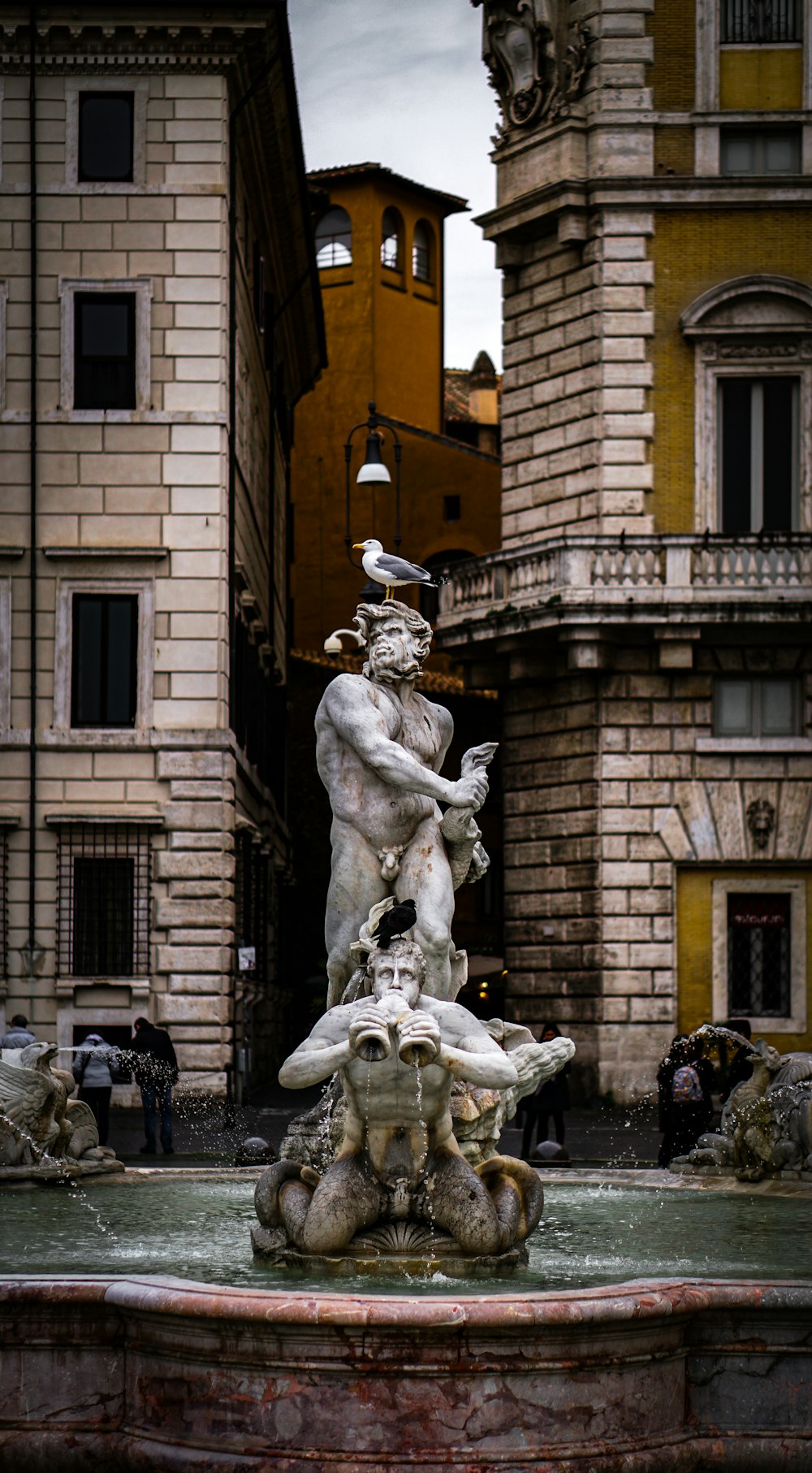 man holding a baby statue