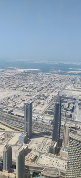 Aerial view of a cityscape with modern buildings and roads.