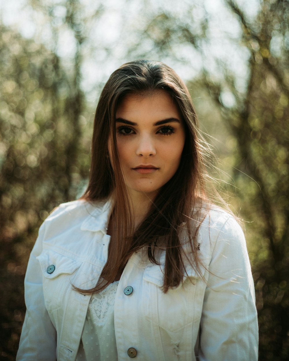 woman in white dress shirt smiling