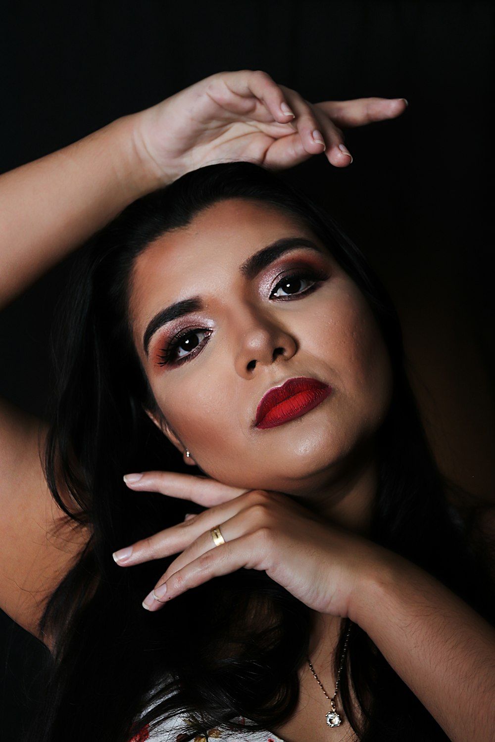 woman with red lipstick and black mascara