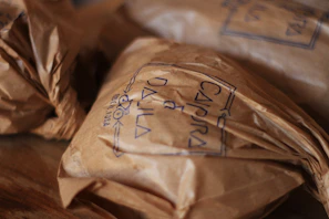 Close-up of kraft paper bags stacked neatly, showcasing natural texture and eco-friendly design.