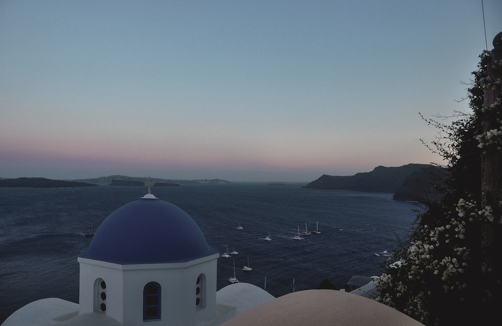 white and blue dome building near body of water during daytime