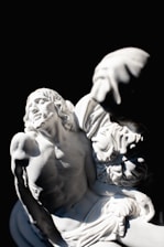 a black and white photo of a statue