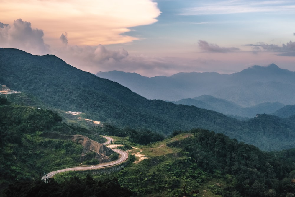 green mountains under white clouds during daytime