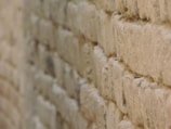 Close-up of detailed masonry work on a restored wall.