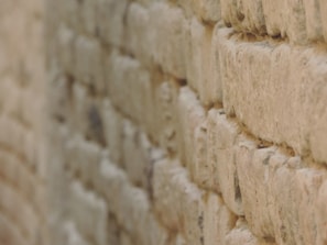 Close-up of detailed masonry work on a restored wall.