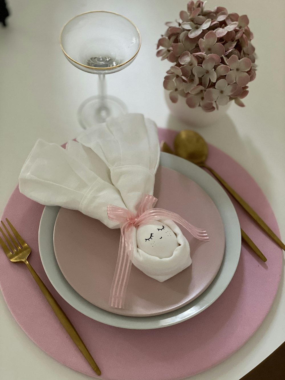 pink and white round cake on pink round plate